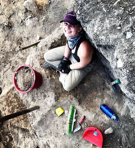 Christie Vogler on an archaeological dig Sicily.