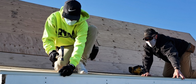 PATCH volunteers repair a roof in Cedar Rapids.